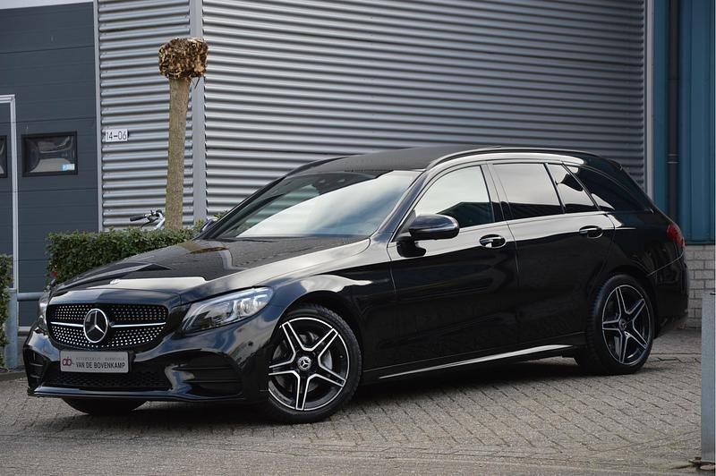 Occasion Mercedes C180 AMG line 157 PK (115 kW) 2021 Zwart Stationwagen