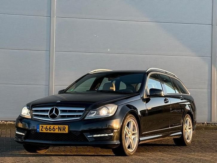 Zwart (metallic) Occasion 2012 Mercedes C250 AMG Stationwagen | € 14.750 (Goede deal) - Afbeelding 1/4