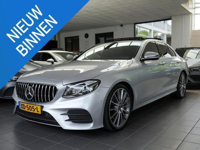 Grijs Gebruikt 2017 Mercedes E220 AMG Sedan | € 24.950 (Eerlijke prijs) - Afbeelding 1/4