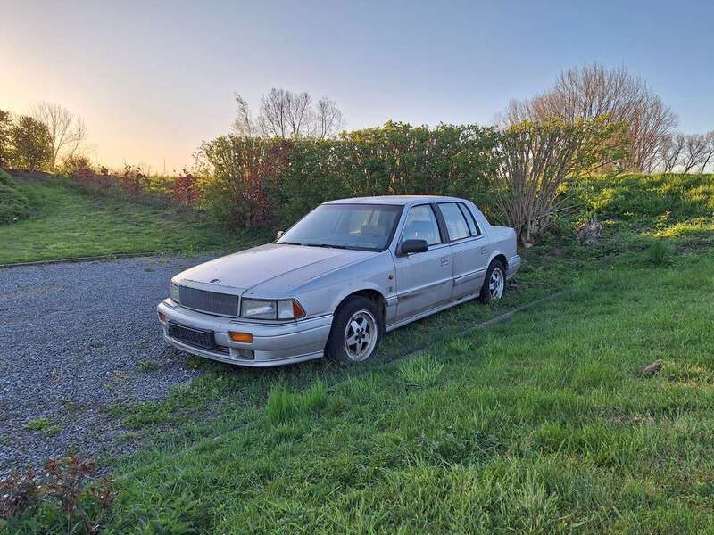 Brons Gebruikt 1990 Chrysler Le Baron Sedan | € 500 - Afbeelding 1/4