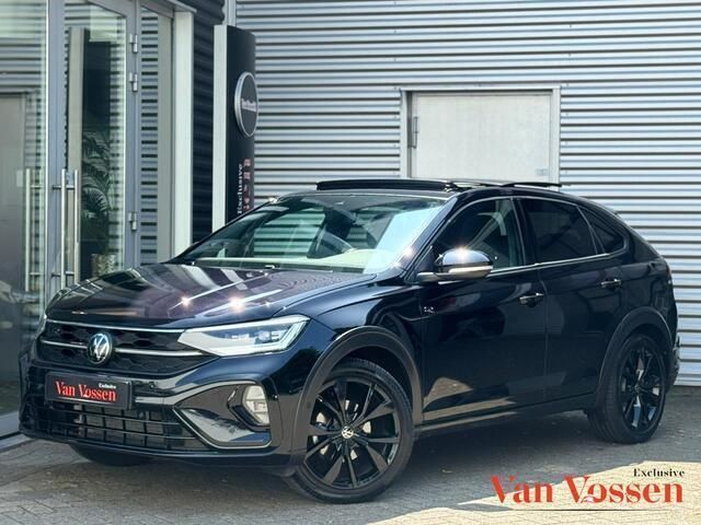 Zwart Gebruikt 2024 VW Taigo R-line SUV | € 32.950 (Eerlijke prijs) - Afbeelding 1/4
