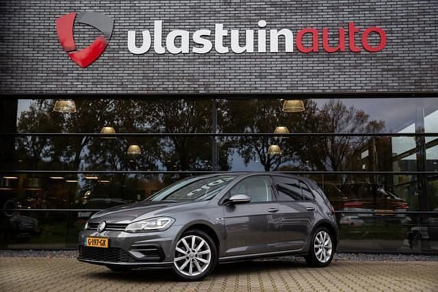 Grijs (metallic) Gebruikt 2018 VW Golf VII Highline Hatchback | € 15.950 (Goede deal) - Afbeelding 1/4