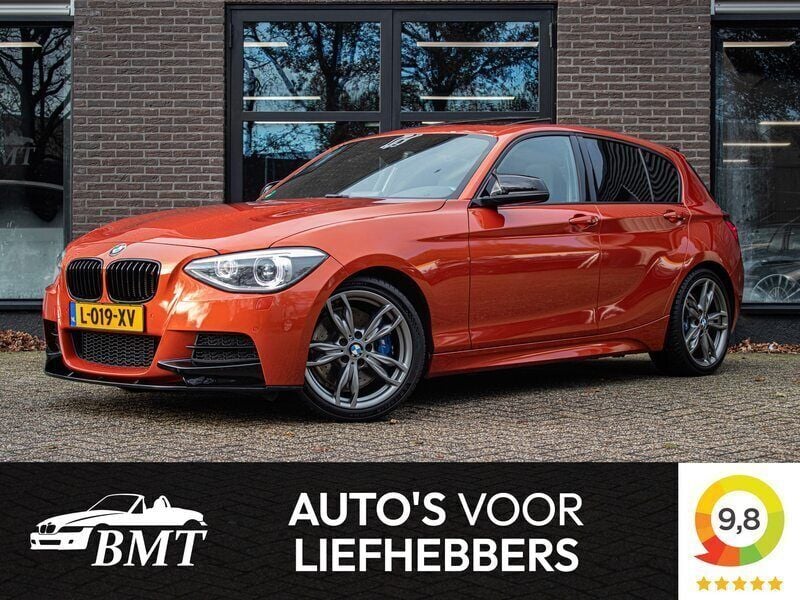 Oranje Gebruikt 2013 BMW M135 M Sport Hatchback | € 22.950 - Afbeelding 1/4