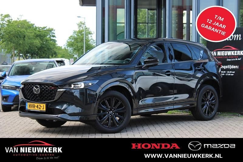 Jet black (zwart mica) Gebruikt 2024 Mazda CX-5 Homura-Line SUV | € 41.900 (Eerlijke prijs) - Afbeelding 1/4