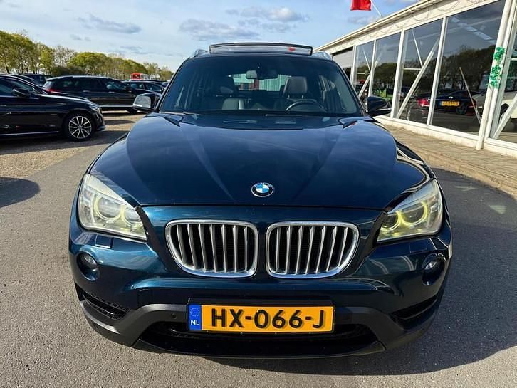 Blauw Gebruikt 2012 BMW X1 Sport Line SUV | € 8.555 - Afbeelding 1/4