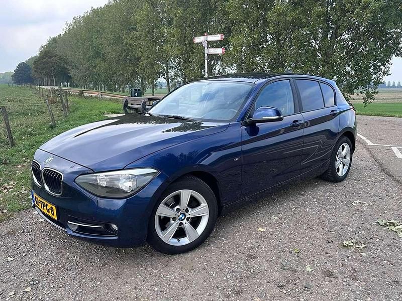 Blauw Gebruikt 2012 BMW 116 Sport Line Hatchback | € 6.350 (Goede deal) - Afbeelding 1/4