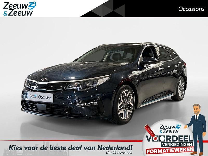 Gravity blue metallic (b4u) Gebruikt 2019 Kia Optima Hybrid Sedan | € 20.945 (Eerlijke prijs) - Afbeelding 1/4