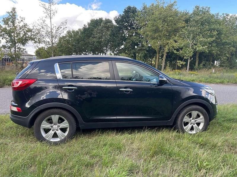 Zwart Gebruikt 2012 Kia Sportage Plus SUV | € 11.950 (Eerlijke prijs) - Afbeelding 1/4