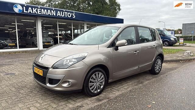 Bruin (metallic) Gebruikt 2011 Renault Scénic III Authentique MPV | € 5.950 - Afbeelding 1/4
