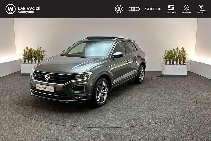 Indium grey Gebruikt 2022 VW T-Roc R-line SUV | € 31.395 (Eerlijke prijs) - Afbeelding 1/3