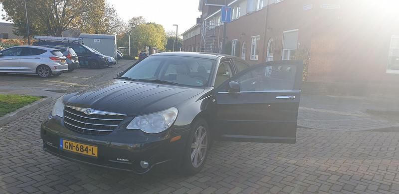Zwart (metallic) Gebruikt 2010 Chrysler Sebring Limited Sedan | € 4.800 - Afbeelding 1/4