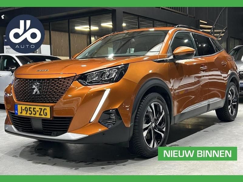 Oranje (metallic) Gebruikt 2020 Peugeot e-2008 Allure SUV | € 13.934 (Eerlijke prijs) - Afbeelding 1/4