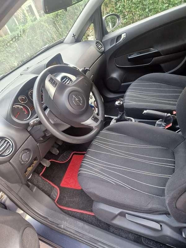 Blauw Gebruikt 2009 Opel Corsa Enjoy MPV | € 2.000 (Goede deal) - Afbeelding 1/4