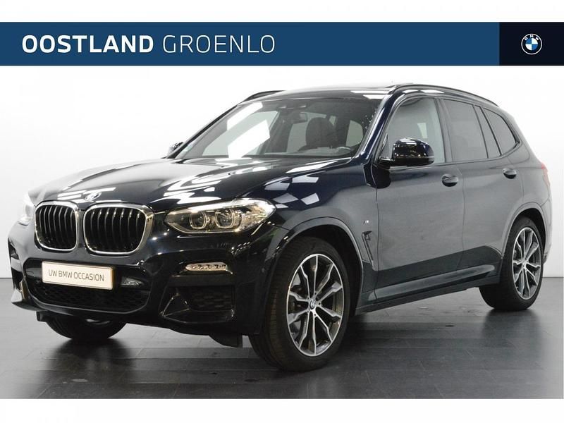 M carbonschwarz (donker zwart metallic) Gebruikt 2018 BMW X3 Comfort Edition SUV | € 37.950 - Afbeelding 1/4