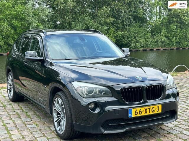Zwart Gebruikt 2012 BMW X1 Executive SUV | € 9.499 (Goede deal) - Afbeelding 1/4