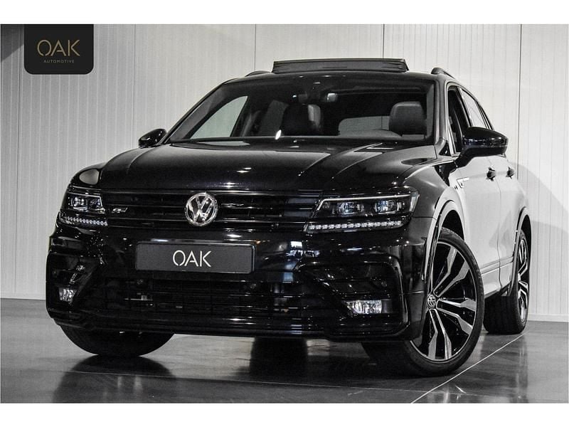 Zwart (metallic) Gebruikt 2019 VW Tiguan R-line SUV | € 29.900 (Iets duurder) - Afbeelding 1/3