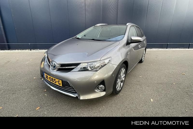 Bruin Gebruikt 2015 Toyota Auris Touring Sports Executive Stationwagen | € 15.950 (Iets duurder) - Afbeelding 1/4