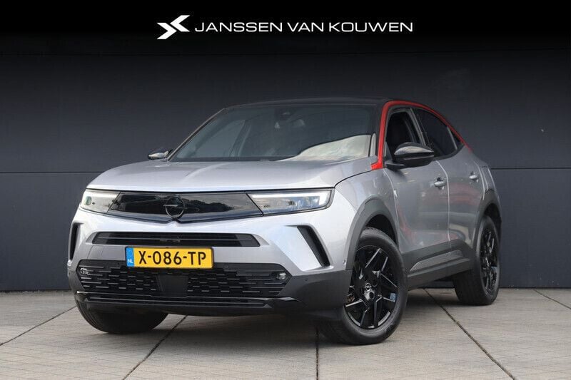 Grijs Gebruikt 2024 Opel Mokka-e SUV | € 23.885 (Eerlijke prijs) - Afbeelding 1/4
