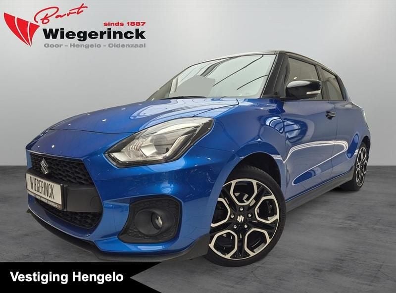 Blauw, metallic lak Gebruikt 2021 Suzuki Swift Sport Hatchback | € 19.799 (Eerlijke prijs) - Afbeelding 1/4