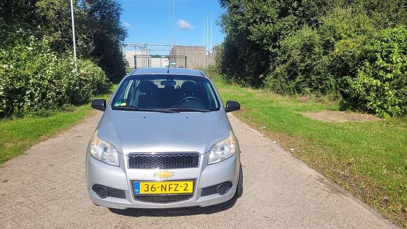 Grijs Gebruikt 2010 Chevrolet Aveo Hatchback | € 2.900 (Iets duurder) - Afbeelding 1/4