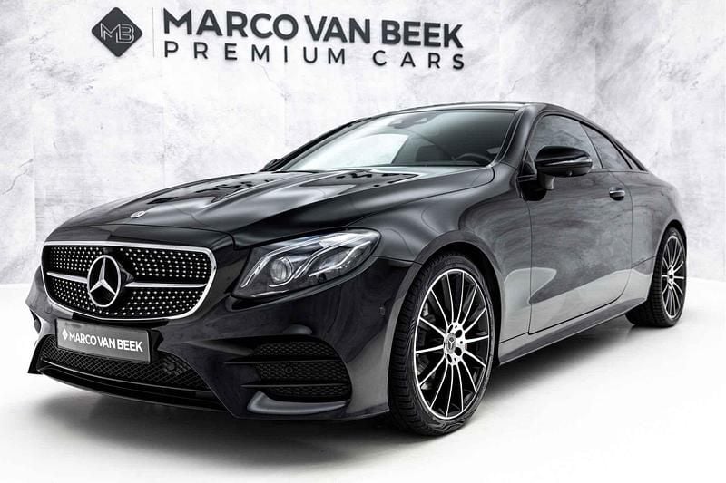 197 obsidiaanzwart metallic Gebruikt 2018 Mercedes E300 Premium Plus Coupé | € 29.850 (Goede deal) - Afbeelding 1/3
