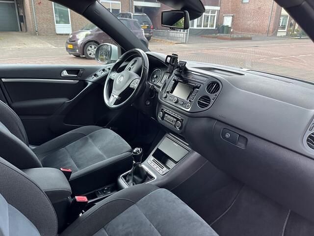 Paars, metallic lak Gebruikt 2013 VW Tiguan SUV | € 10.450 (Goede deal) - Afbeelding 1/3