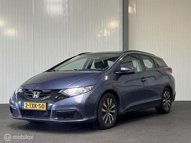Blauw, metallic lak Gebruikt 2014 Honda Civic Comfort Stationwagen | € 2.945 - Afbeelding 1/4