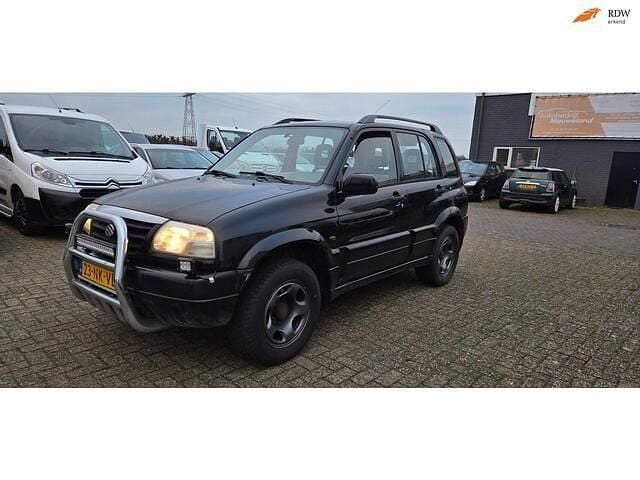 Zwart Gebruikt 2001 Suzuki Grand Vitara SUV | € 3.450 (Goede deal) - Afbeelding 1/4