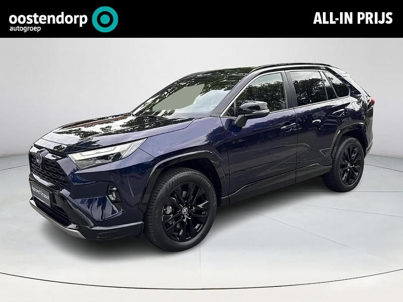 Midnight blue met zwart dak blauw Gebruikt 2023 Toyota RAV4 Hybrid Style SUV | € 41.949 (Eerlijke prijs) - Afbeelding 1/4