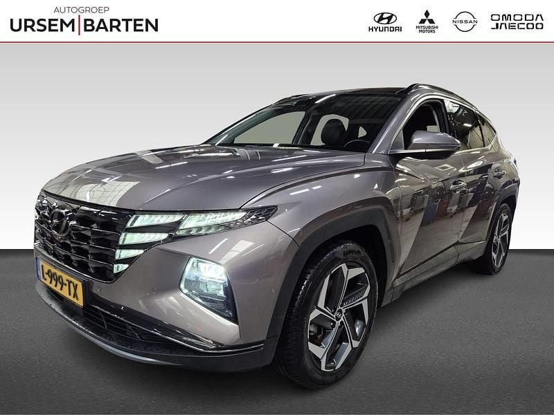Bruin metallic Gebruikt 2021 Hyundai Tucson Premium SUV | € 29.730 (Eerlijke prijs) - Afbeelding 1/4