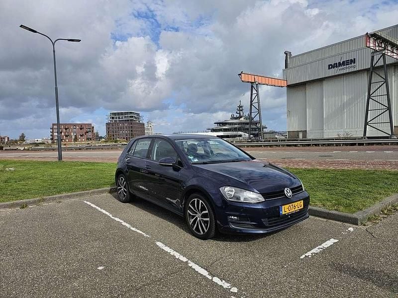 Blauw Gebruikt 2012 VW Golf VII Highline Stationwagen | € 6.980 (Eerlijke prijs) - Afbeelding 1/4