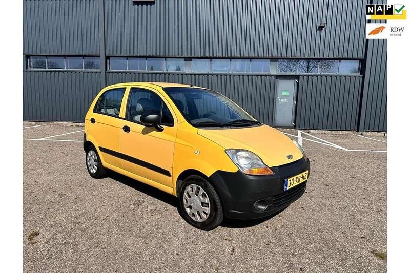 Geel Occasion 2007 Chevrolet Matiz Hatchback | € 1.095 (Eerlijke prijs) - Afbeelding 1/4