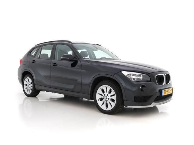 Black saphire metallic Gebruikt 2015 BMW X1 Executive SUV | € 9.945 (Eerlijke prijs) - Afbeelding 1/4