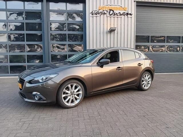 Grijs Gebruikt 2015 Mazda 3 Hatchback | € 16.250 (Eerlijke prijs) - Afbeelding 1/4