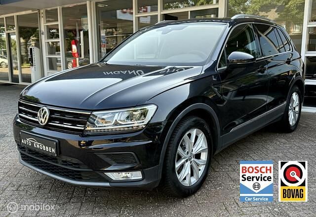 Zwart, metallic lak Gebruikt 2016 VW Tiguan Highline SUV | € 17.950 (Eerlijke prijs) - Afbeelding 1/4