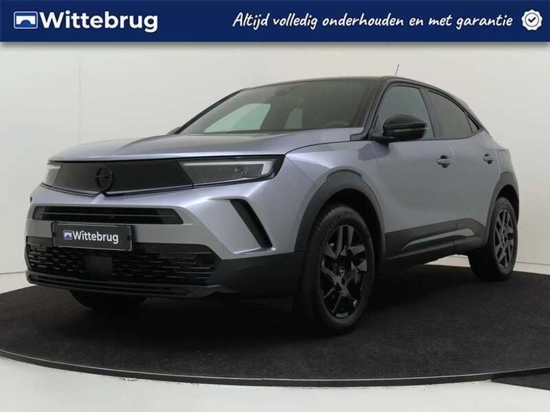 Grijs, metallic lak Gebruikt 2024 Opel Mokka SUV | € 23.925 (Eerlijke prijs) - Afbeelding 1/3
