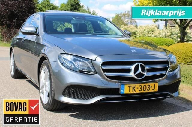 Grijs, metallic lak Gebruikt 2017 Mercedes E250 Prestige Sedan | € 27.750 (Eerlijke prijs) - Afbeelding 1/4