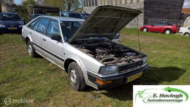 Grijs Gebruikt 1986 Nissan Bluebird Hatchback | € 950 - Afbeelding 1/4