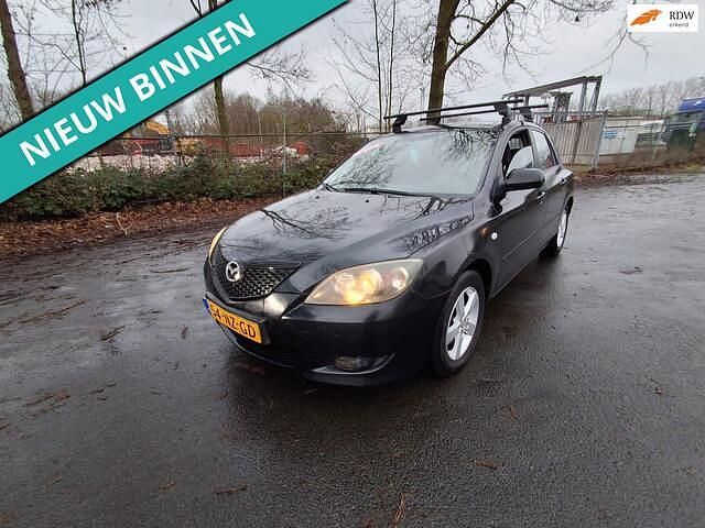 Zwart Occasion 2004 Mazda 3 Inclusive Hatchback | € 1.299 (Eerlijke prijs) - Afbeelding 1/4