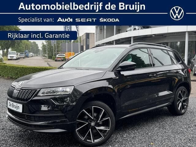 Zwart Gebruikt 2019 Skoda Karoq SportLine SUV | € 27.950 (Eerlijke prijs) - Afbeelding 1/4