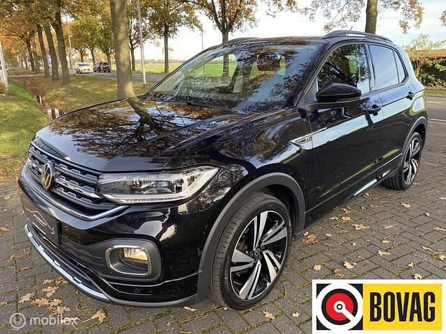 Zwart Gebruikt 2021 VW T-Cross R-line SUV | € 25.745 (Eerlijke prijs) - Afbeelding 1/4