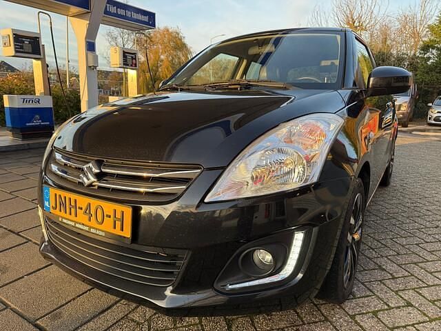 Zwart Gebruikt 2015 Suzuki Swift Exclusive Hatchback | € 8.950 (Eerlijke prijs) - Afbeelding 1/4