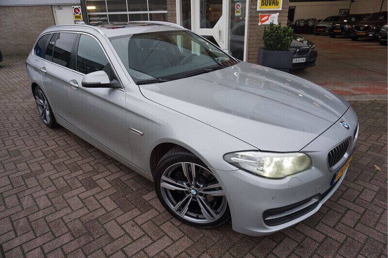 Grijs Gebruikt 2015 BMW 518 Executive Stationwagen | € 10.785 - Afbeelding 1/4