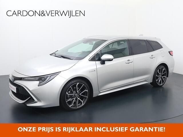 Grijs Gebruikt 2019 Toyota Corolla Executive Stationwagen | € 23.840 (Goede deal) - Afbeelding 1/4
