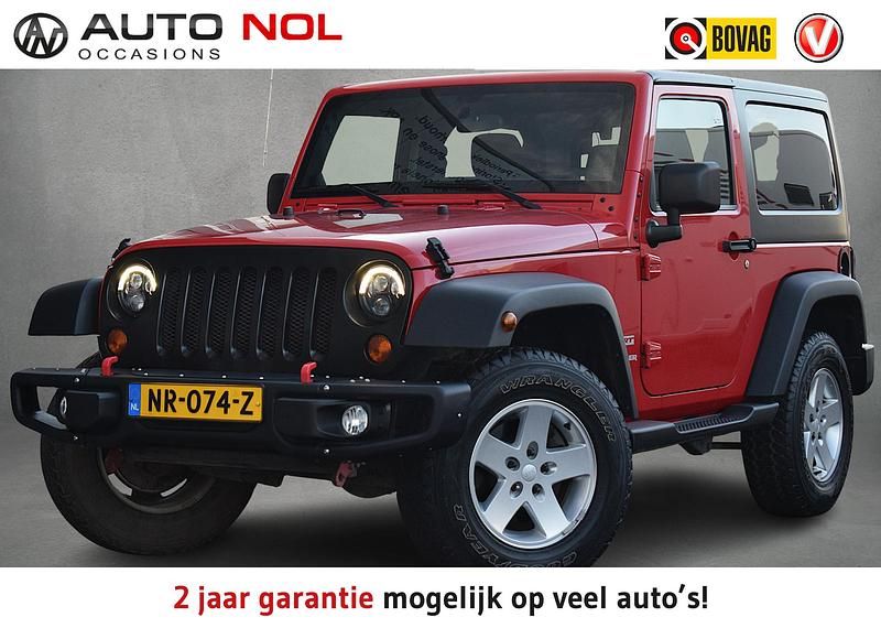 Rood Occasion 2017 Jeep Wrangler Sahara SUV | € 29.950 - Afbeelding 1/4