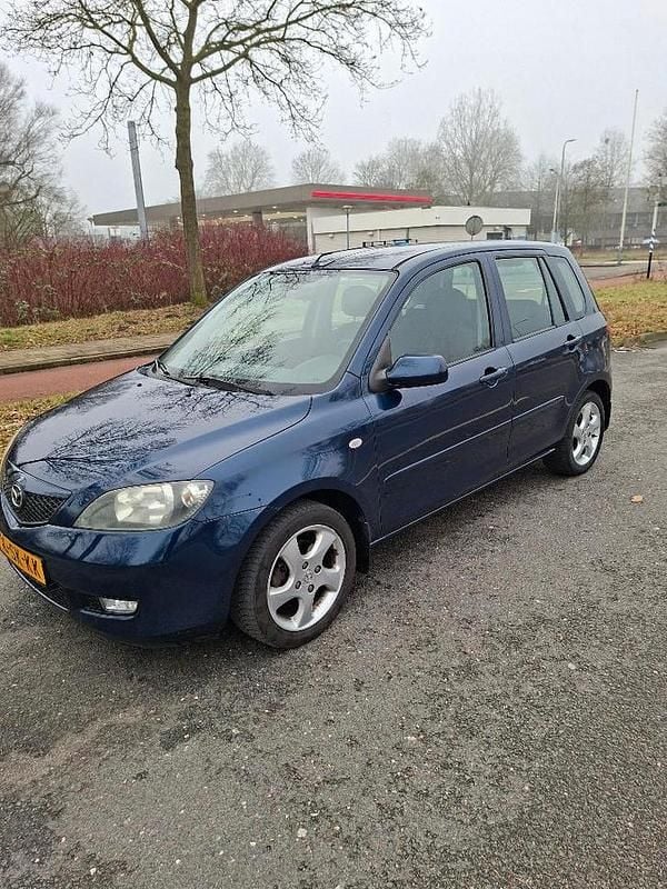 Blauw Occasion 2006 Mazda 2 Touring Hatchback | € 950 (Eerlijke prijs) - Afbeelding 1/4