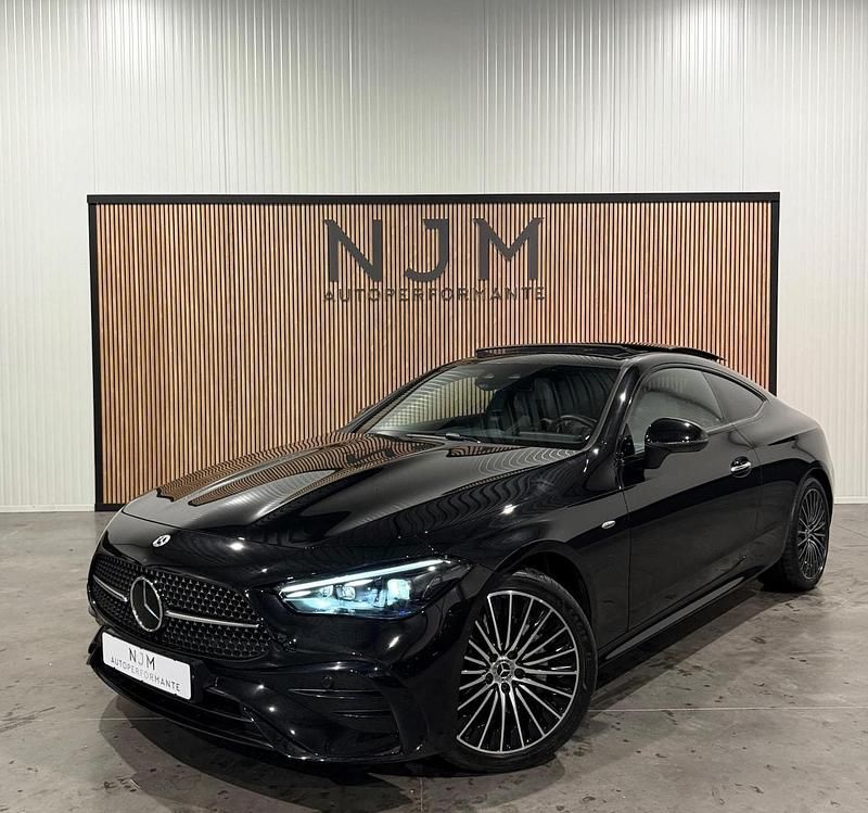 Zwart (metallic) Occasion 2024 Mercedes E300 AMG Coupé | € 59.950 (Super prijs) - Afbeelding 1/4