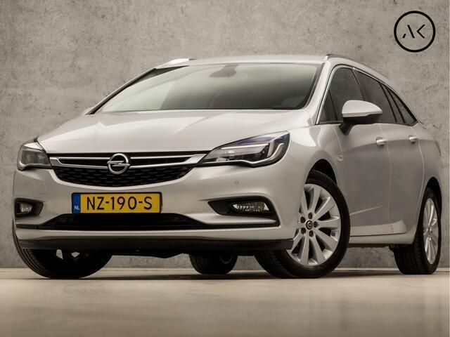 Grijs Gebruikt 2017 Opel Astra Sport Stationwagen | € 12.745 (Eerlijke prijs) - Afbeelding 1/4