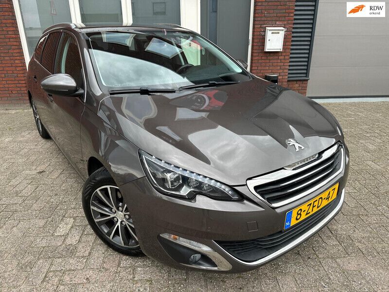 Grijs, metallic lak Gebruikt 2014 Peugeot 308 Allure Stationwagen | € 7.200 (Iets duurder) - Afbeelding 1/4