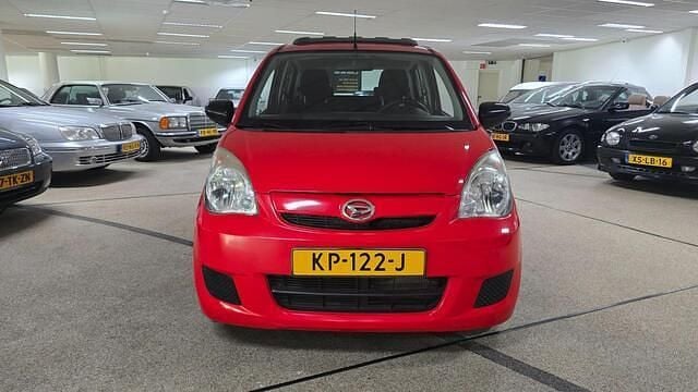 Occasion Daihatsu Cuore 69 PK (50 kW) 2008 Rood Hatchback